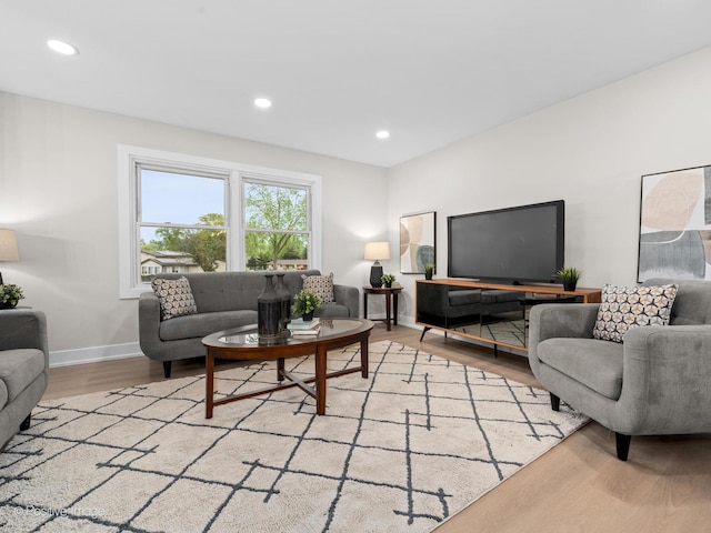 6950 Longmeadow Ln, Hanover Park, IL 60133 - living room with light wood finished floors and recessed lighting