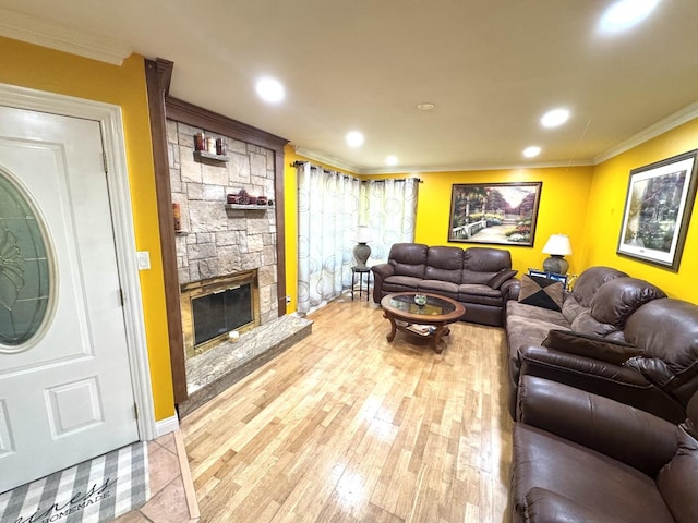 26575 N Fairfield Rd, Wauconda, IL 60084 - living room with crown molding, light wood finished floors, a stone fireplace, and recessed lighting