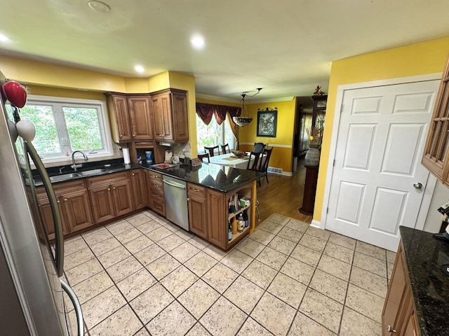 26575 N Fairfield Rd, Wauconda, IL 60084 - kitchen featuring stainless steel appliances, light tile patterned floors, brown cabinets, healthy amount of natural light, and crown molding