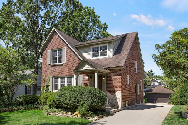 3838 Johnson Ave, Western Springs, IL 60558 - view of front of house with an outdoor structure, a detached garage, roof with shingles, a front lawn, and brick siding