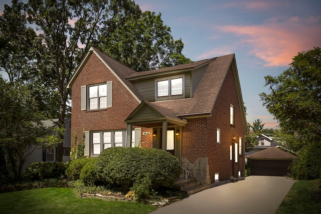 3838 Johnson Ave, Western Springs, IL 60558 - view of front of house with an outdoor structure, brick siding, a yard, roof with shingles, and a garage