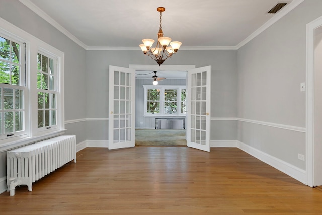 3838 Johnson Ave, Western Springs, IL 60558 - unfurnished dining area with french doors, radiator heating unit, light wood-style floors, and ornamental molding