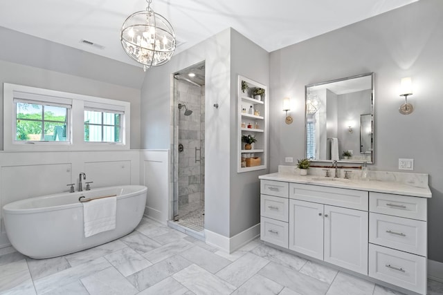 125 S Madison St, Hinsdale, IL 60521 - full bath featuring marble look tiles, a freestanding tub, a shower stall, and vanity