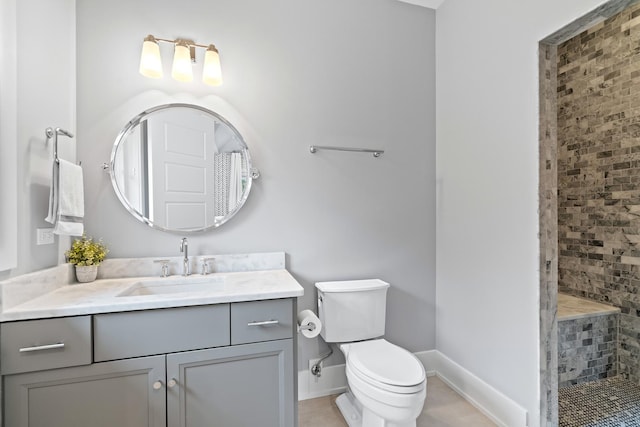 125 S Madison St, Hinsdale, IL 60521 - bathroom featuring tiled shower, vanity, and tile patterned floors