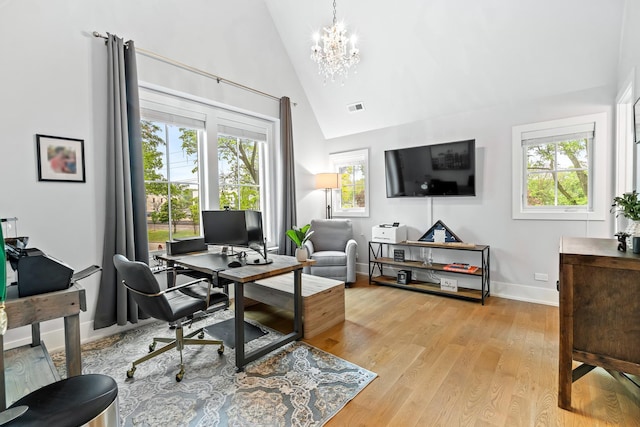 125 S Madison St, Hinsdale, IL 60521 - office space featuring a chandelier, healthy amount of natural light, high vaulted ceiling, and light wood-style flooring