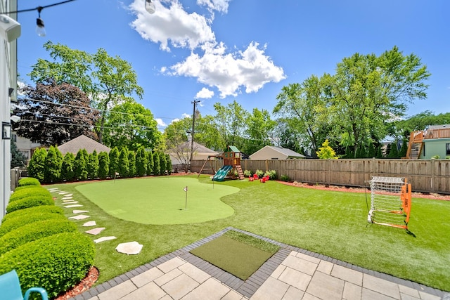 125 S Madison St, Hinsdale, IL 60521 - fenced backyard featuring an area to practice putting and a playground