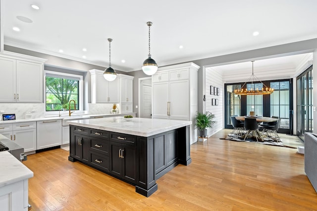 125 S Madison St, Hinsdale, IL 60521 - kitchen featuring dishwasher, a chandelier, white cabinetry, dark cabinets, and crown molding