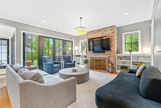 125 S Madison St, Hinsdale, IL 60521 - living room with a chandelier, healthy amount of natural light, crown molding, recessed lighting, and a fireplace