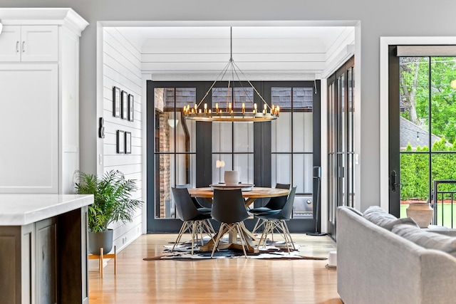 125 S Madison St, Hinsdale, IL 60521 - dining room featuring a chandelier and light wood-style floors