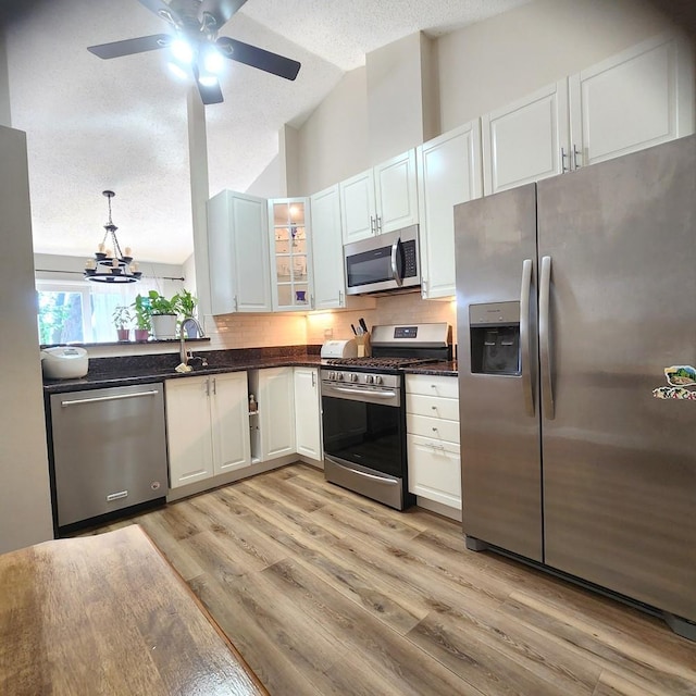 614 Lyon Ct, Buffalo Grove, IL 60089 - kitchen with appliances with stainless steel finishes, a textured ceiling, glass insert cabinets, light wood-style flooring, and ceiling fan