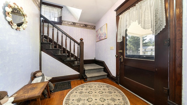 215 E 3rd St, Byron, IL 61010 - entrance foyer with stairs, wood finished floors, healthy amount of natural light, and wallpapered walls