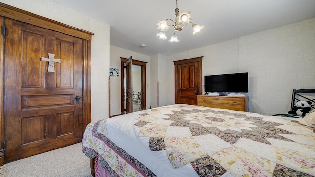 215 E 3rd St, Byron, IL 61010 - carpeted bedroom featuring a chandelier