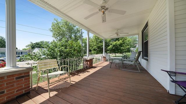 215 E 3rd St, Byron, IL 61010 - wooden porch with ceiling fan