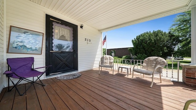 215 E 3rd St, Byron, IL 61010 - view of wooden porch