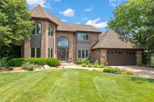 9901 Mission, Palos Park, IL 60464 - view of front of home featuring an attached garage, a front lawn, concrete driveway, and brick siding