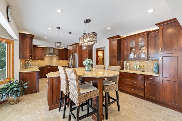 9901 Mission, Palos Park, IL 60464 - kitchen featuring wall chimney exhaust hood, a kitchen island, recessed lighting, appliances with stainless steel finishes, and tasteful backsplash