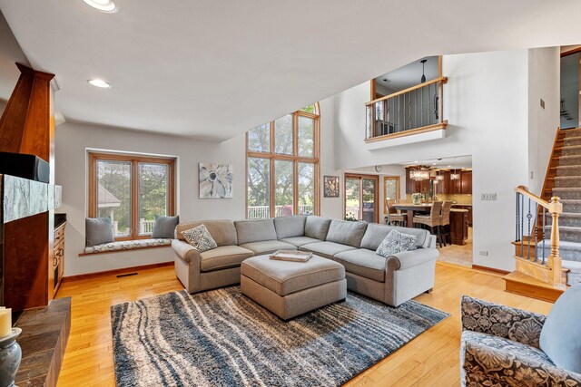 9901 Mission, Palos Park, IL 60464 - living room featuring stairs, light wood finished floors, recessed lighting, and a towering ceiling