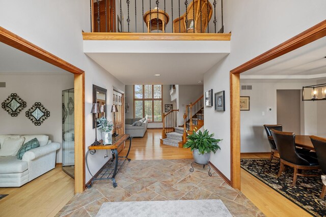 9901 Mission, Palos Park, IL 60464 - foyer with stairway, a towering ceiling, wood finished floors, and a chandelier