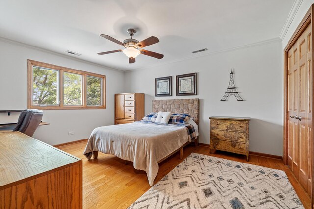 9901 Mission, Palos Park, IL 60464 - bedroom featuring ornamental molding, light wood finished floors, ceiling fan, a closet, and a desk