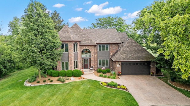 9901 Mission, Palos Park, IL 60464 - view of front facade featuring an attached garage, a front lawn, concrete driveway, and brick siding