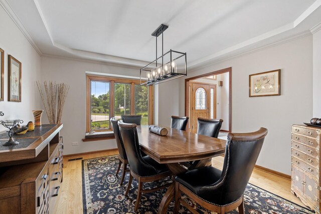 9901 Mission, Palos Park, IL 60464 - dining area with a raised ceiling, light wood-style flooring, plenty of natural light, and ornamental molding