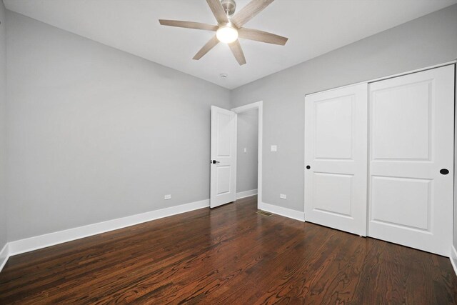 5426 N Bernard St, Chicago, IL 60625 - unfurnished bedroom featuring dark wood-style floors, a closet, and a ceiling fan