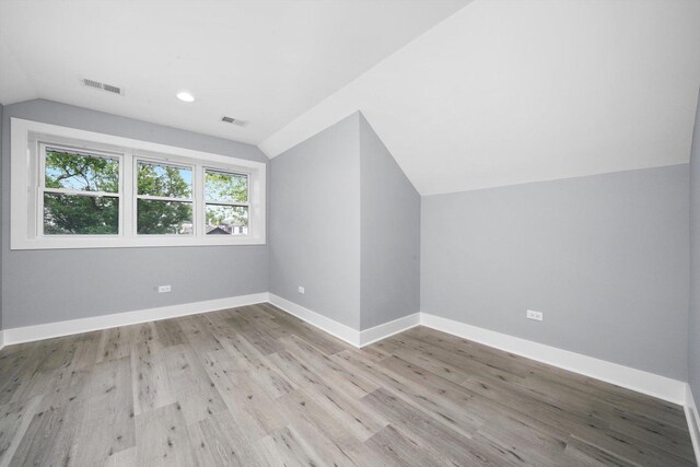 5426 N Bernard St, Chicago, IL 60625 - additional living space with vaulted ceiling, wood finished floors, and recessed lighting