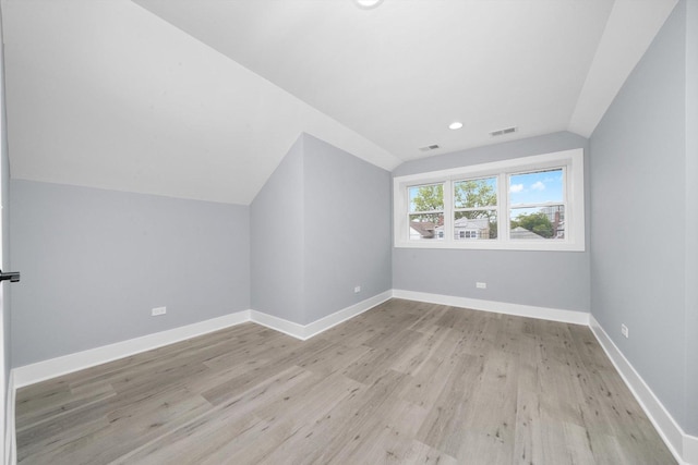 5426 N Bernard St, Chicago, IL 60625 - additional living space featuring lofted ceiling, wood finished floors, and recessed lighting