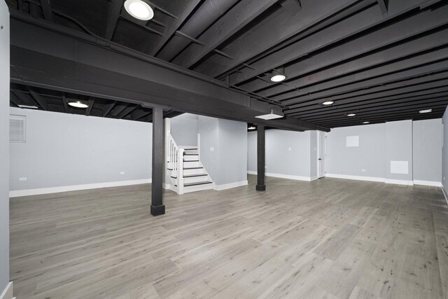 5426 N Bernard St, Chicago, IL 60625 - finished basement featuring stairway and wood finished floors