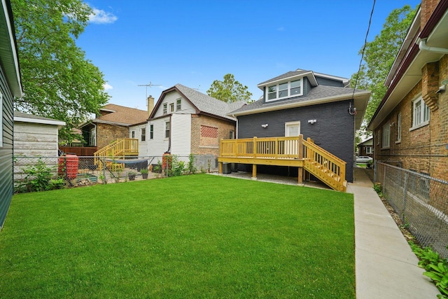5426 N Bernard St, Chicago, IL 60625 - rear view of property with a fenced backyard, a wooden deck, stairway, and brick siding