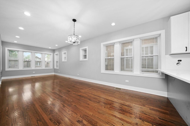 5426 N Bernard St, Chicago, IL 60625 - unfurnished living room featuring a chandelier, recessed lighting, and dark wood-style flooring