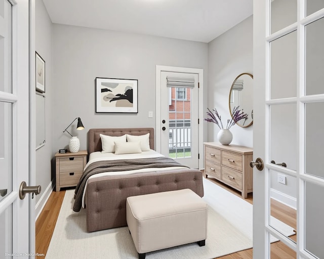 4023 N Southport Ave Unit 1, Chicago, IL 60613 - bedroom with access to exterior and light wood finished floors