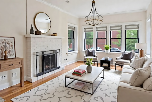 4023 N Southport Ave Unit 1, Chicago, IL 60613 - living room featuring light wood-style flooring, crown molding, and a brick fireplace