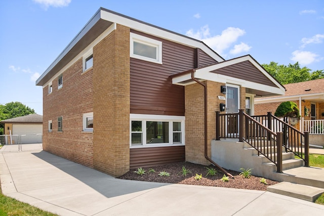 2637 W 93rd Pl, Evergreen Park, IL 60805 - view of front facade featuring an outdoor structure, brick siding, and a detached garage
