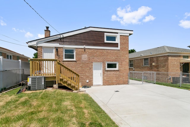 2637 W 93rd Pl, Evergreen Park, IL 60805 - back of house with a chimney and brick siding