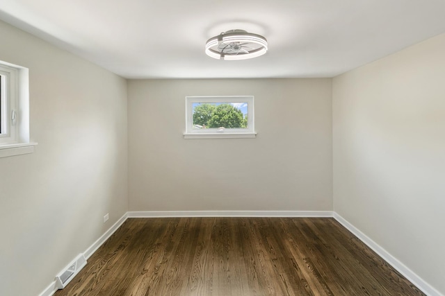 2637 W 93rd Pl, Evergreen Park, IL 60805 - spare room featuring dark wood-type flooring and baseboards
