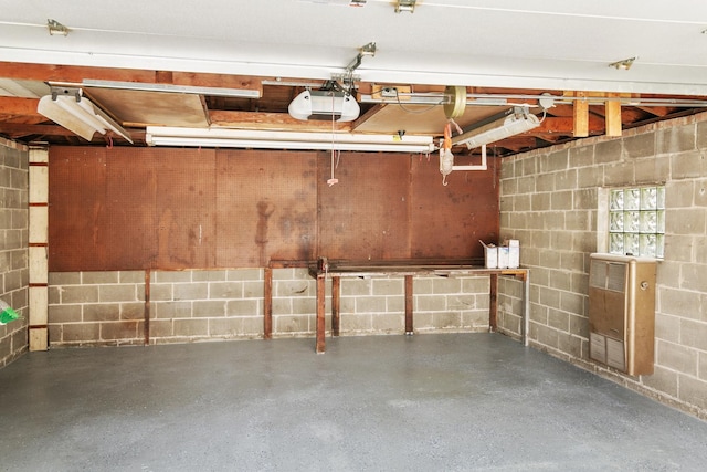 2637 W 93rd Pl, Evergreen Park, IL 60805 - garage with a garage door opener, concrete block wall, and heating unit