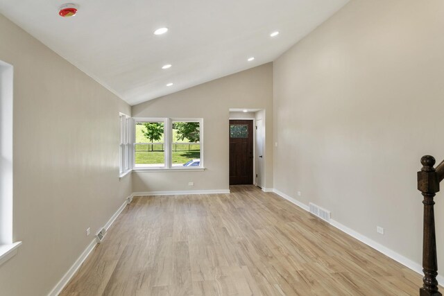 2637 W 93rd Pl, Evergreen Park, IL 60805 - spare room featuring vaulted ceiling, light wood finished floors, recessed lighting, and a smoke detector