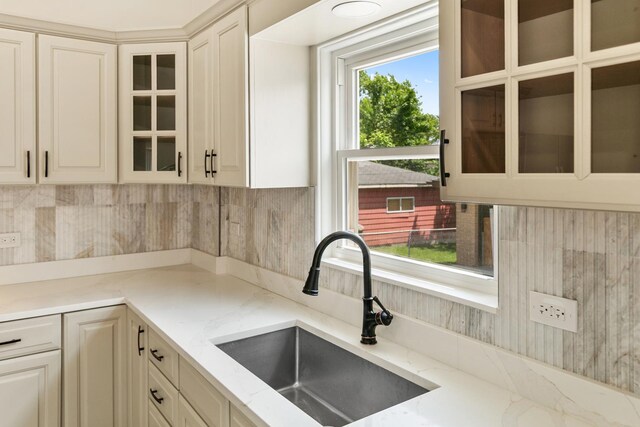 2637 W 93rd Pl, Evergreen Park, IL 60805 - kitchen featuring light stone counters, tasteful backsplash, and glass insert cabinets