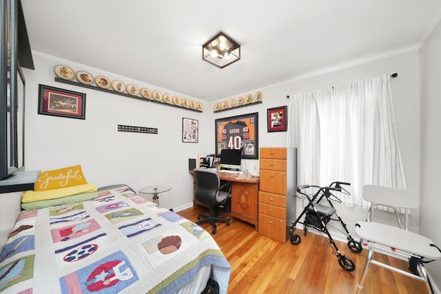 14848 Keystone Ave, Midlothian, IL 60445 - bedroom featuring light wood finished floors, crown molding, and a desk