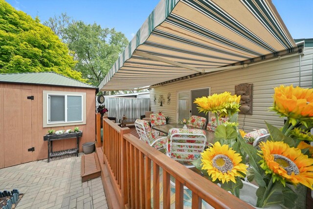 14848 Keystone Ave, Midlothian, IL 60445 - deck featuring outdoor dining space, an outbuilding, and a patio area