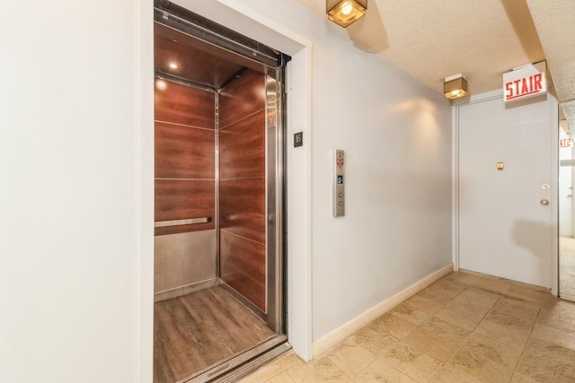 5471 S Hyde Park Blvd Unit 16Ab, Chicago, IL 60615 - corridor featuring elevator and baseboards