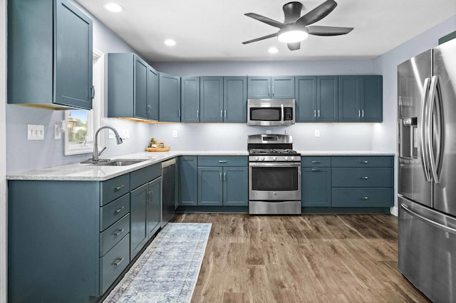 1106 Countryside Ln, Pontiac, IL 61764 - kitchen with appliances with stainless steel finishes, dark wood-style floors, light countertops, ceiling fan, and recessed lighting