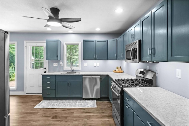1106 Countryside Ln, Pontiac, IL 61764 - kitchen featuring stainless steel appliances, light countertops, dark wood-type flooring, recessed lighting, and ceiling fan