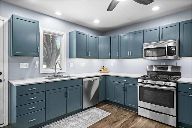 1106 Countryside Ln, Pontiac, IL 61764 - kitchen featuring appliances with stainless steel finishes, dark wood finished floors, light countertops, ceiling fan, and recessed lighting