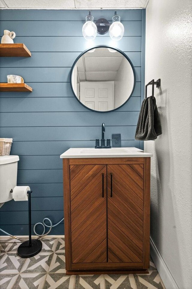 1106 Countryside Ln, Pontiac, IL 61764 - bathroom featuring vanity and wooden walls