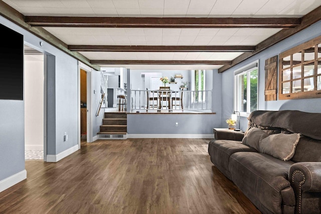 1106 Countryside Ln, Pontiac, IL 61764 - living room with beam ceiling, dark wood-type flooring, and stairs