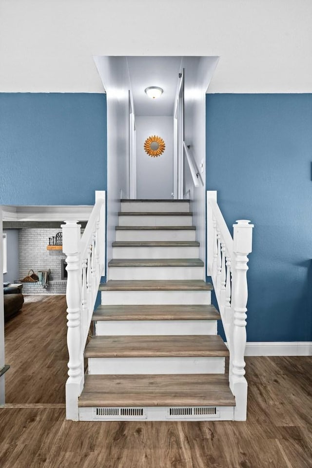 1106 Countryside Ln, Pontiac, IL 61764 - stairway featuring wood finished floors and baseboards