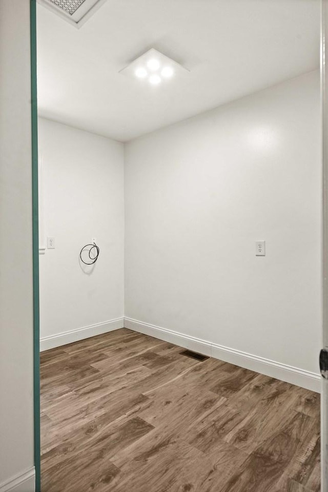 1106 Countryside Ln, Pontiac, IL 61764 - unfurnished room with wood finished floors and baseboards