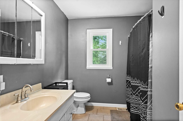 1106 Countryside Ln, Pontiac, IL 61764 - bathroom with vanity, a shower with shower curtain, and tile patterned flooring